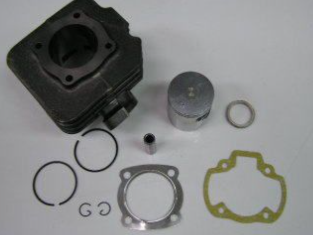 Engine piston and rings set on a white background