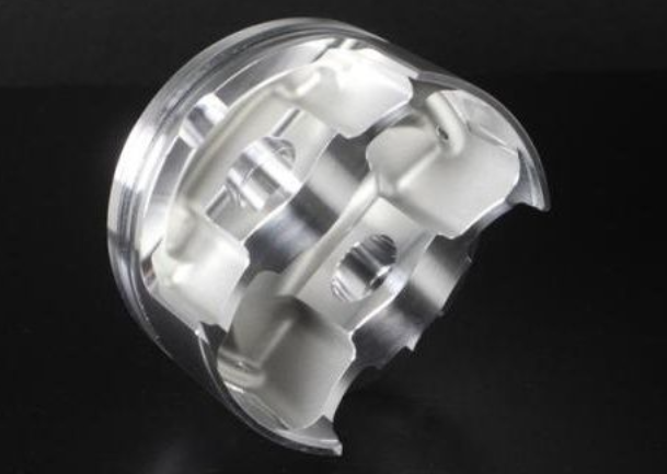 Metallic mechanical component on a black background