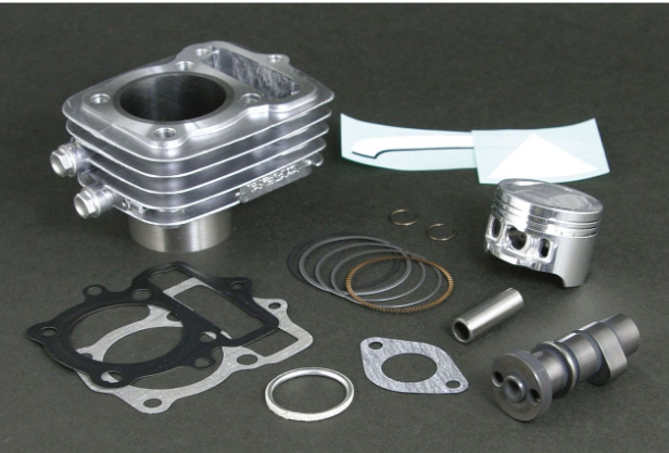 Engine cylinder kit with various components on a dark surface