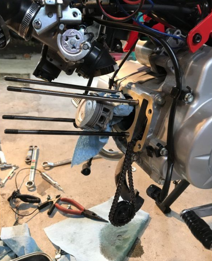 Engine repair work with tools on a workbench