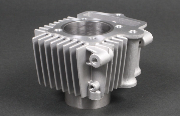 Metallic engine block on a dark background