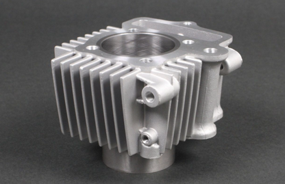 Metallic engine block on a dark background