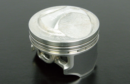 Metallic piston on a dark background