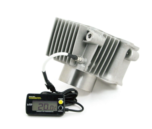 Metallic heat sink with digital thermometer on a white background