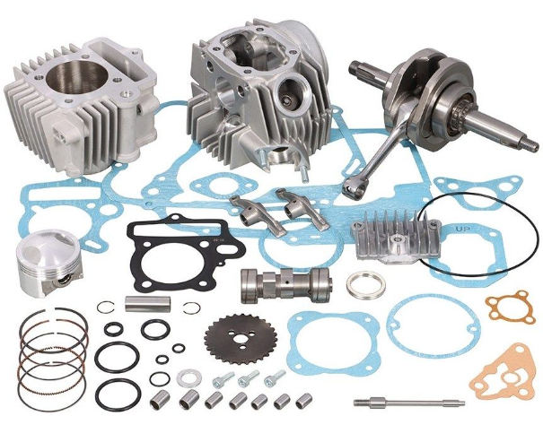 Engine parts including cylinders, piston, and gaskets on a white background