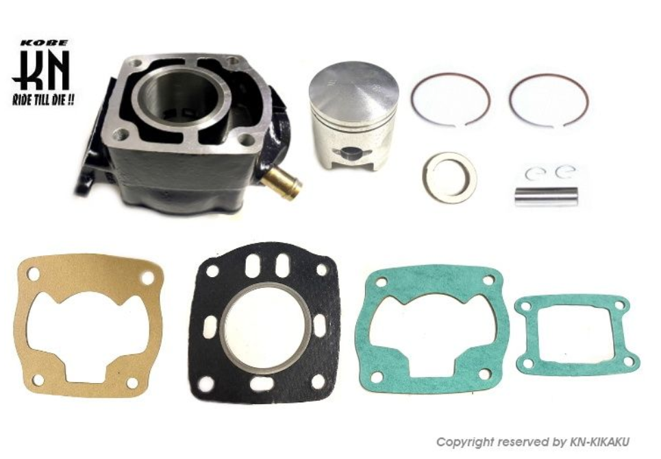 Engine parts including a cylinder, piston, gaskets, and washers on a white background with Kobe branding.