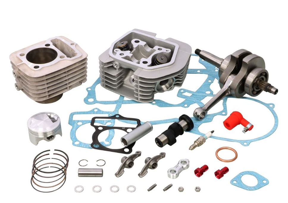 Engine parts including cylinder, piston, crankshaft, and gaskets on a white background
