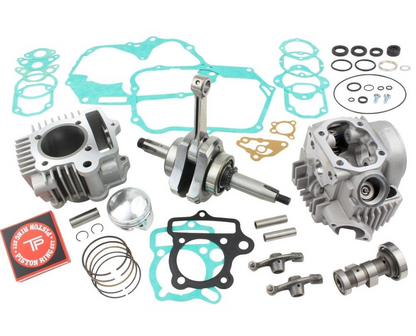 Engine parts and gaskets on a white background