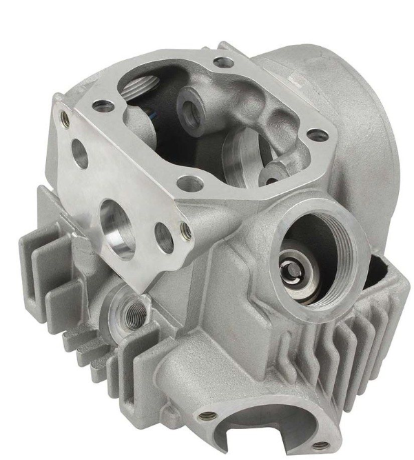 Metal engine cylinder head on a white background