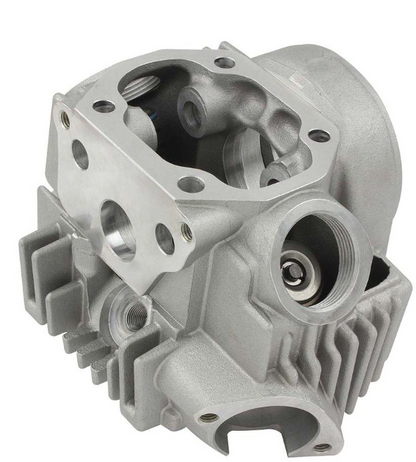 Metal engine cylinder head on a white background