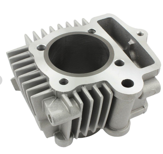 Metal engine cylinder head on a white background