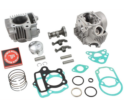Engine parts including cylinders, gaskets, and rings on a white background