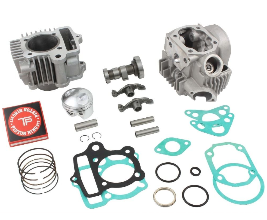Engine parts including cylinders, gaskets, and rings on a white background