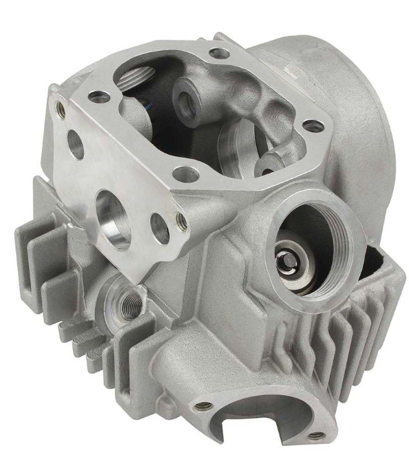 Metal engine cylinder head on a white background