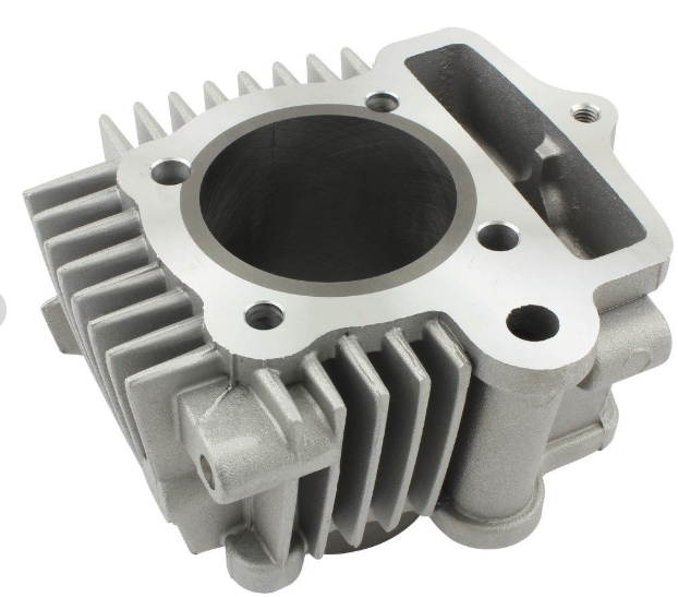 Metallic engine cylinder head on a white background