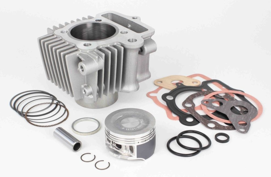 Engine parts including a cylinder, piston, rings, and gaskets on a white background