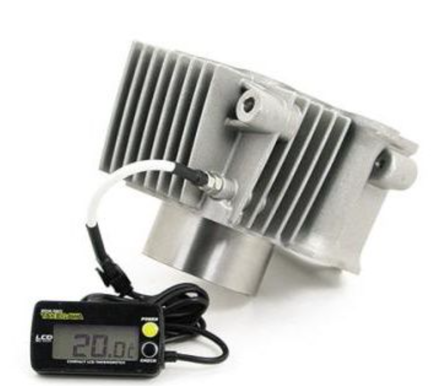 Metallic heat sink with digital temperature gauge on a white background