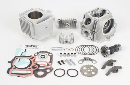 Engine parts including cylinders, gaskets, and bolts on a white background