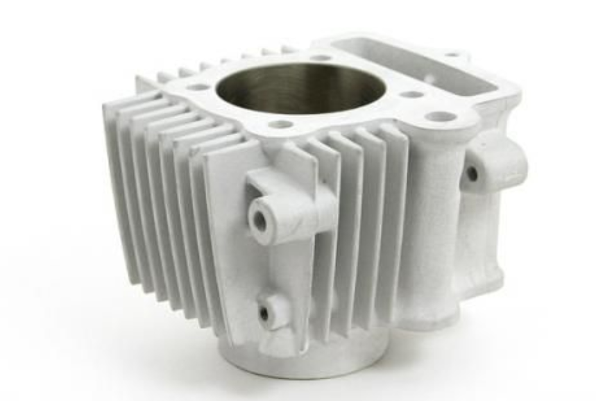 Metal engine cylinder head on a white background