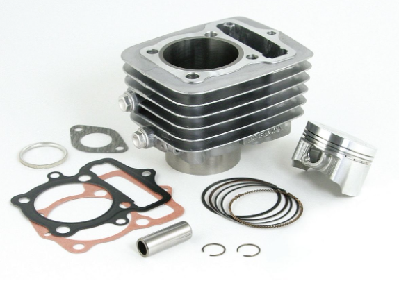 Engine cylinder head assembly with gaskets and rings on a white background