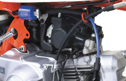 Close-up of a motorcycle engine with visible components and wiring.