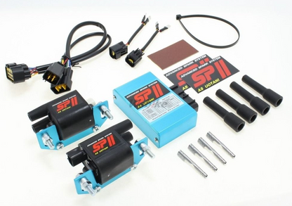 Automotive parts including a blue box, black connectors, and metal components on a white background.