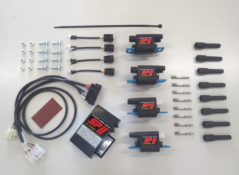 Collection of automotive parts including wiring harnesses and connectors on a white background