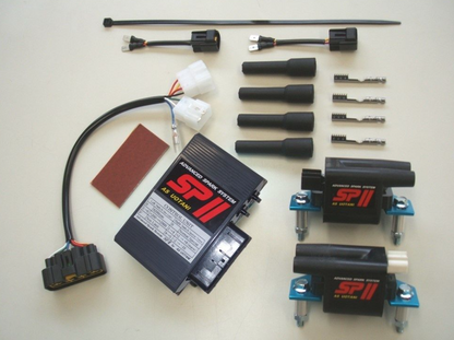 Automotive parts including a black box labeled 'SP II' on a beige background