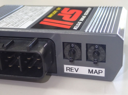 Car tuning module with 'REV' and 'MAP' labels on a white background