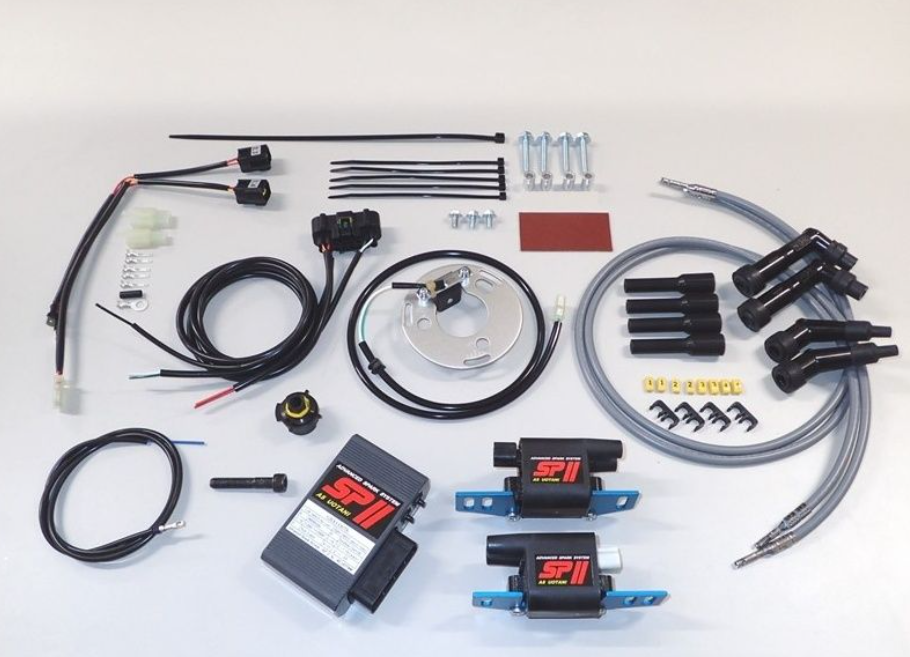 Automotive ignition system components on a white background