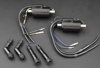 Set of ignition coils and connectors on a dark background