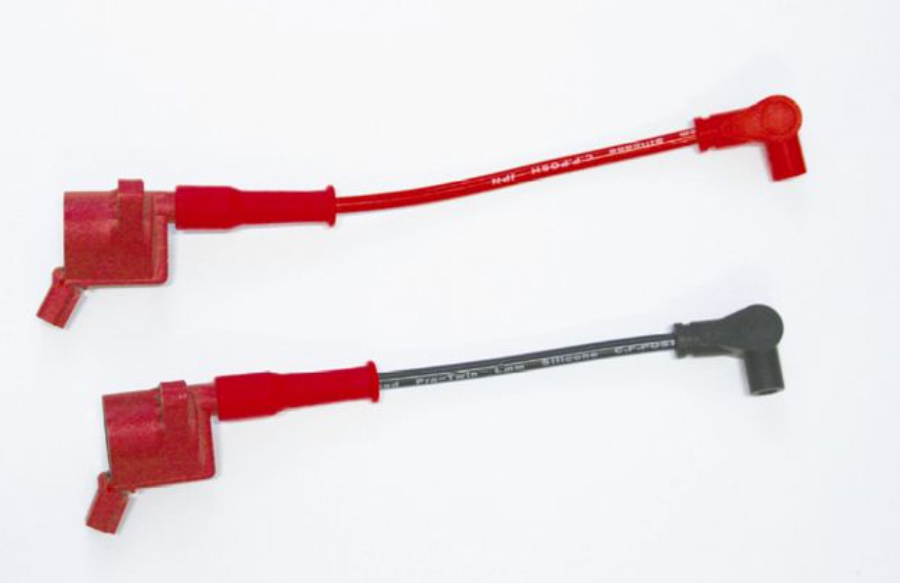 Two red ignition cables on a white background
