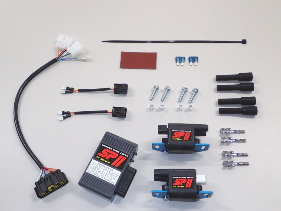 Automotive parts including wiring harnesses, connectors, and electronic components on a white background
