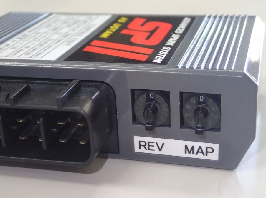 Car tuning module with 'REV' and 'MAP' labels on a white background