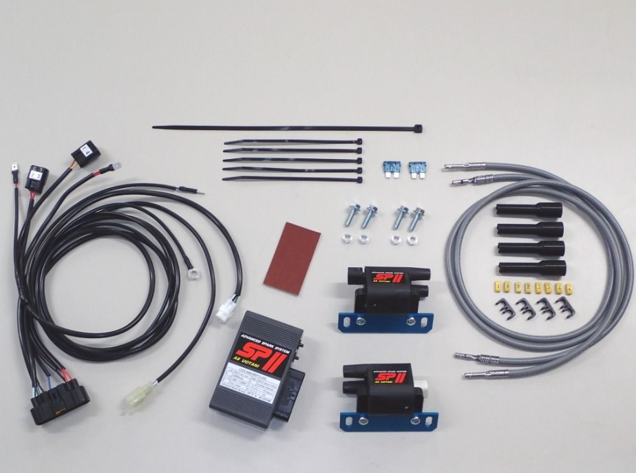 Automotive wiring harness kit with connectors and components on a gray background