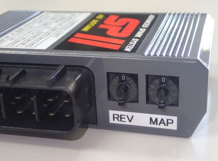 Car tuning module with 'REV' and 'MAP' labels on a white background