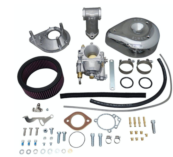 Carburetor and related parts on a white background