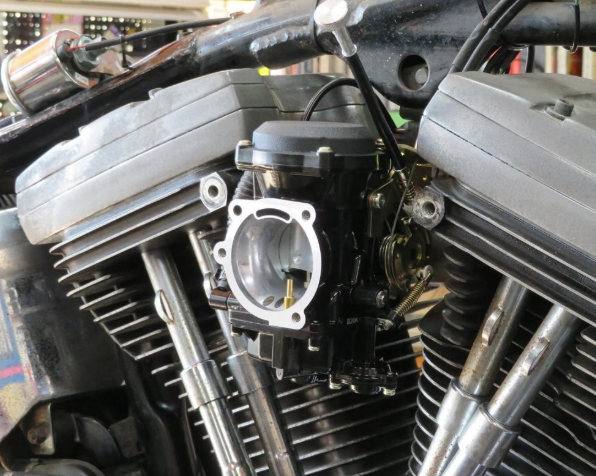 Close-up of a motorcycle engine with visible mechanical components.
