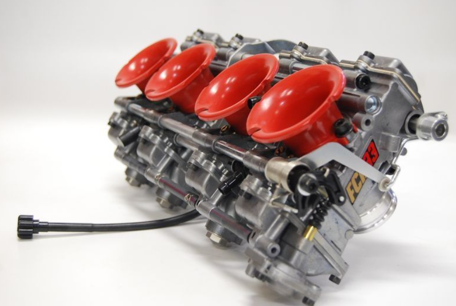 Engine block with red valve covers on a white background