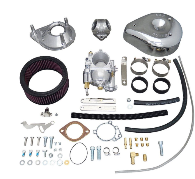 Carburetor kit with various components on a white background
