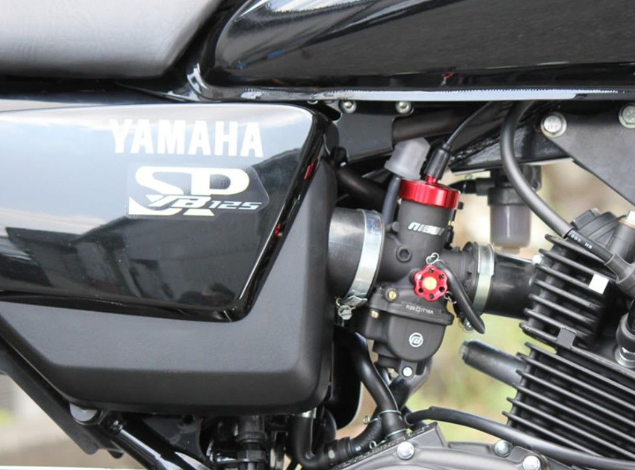 Close-up of a Yamaha motorcycle engine with visible branding.