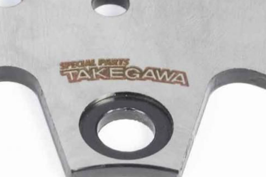 Metal blade with 'Takegawa' branding on a white background