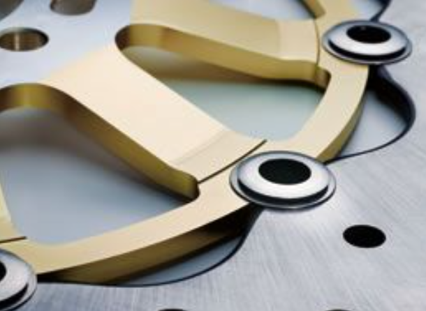 Close-up of a gold ring with metallic background