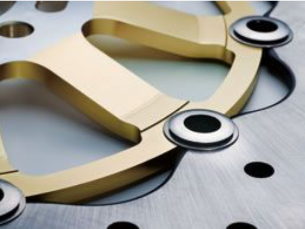 Close-up of a gold buckle on a metallic background