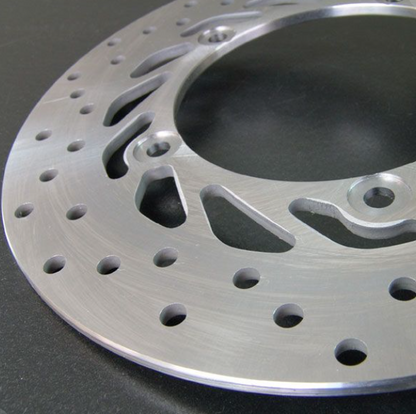 Close-up of a metallic brake disc on a dark background