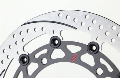 Close-up of a motorcycle disc brake rotor with bolts on a white background