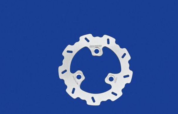 White metal sprocket on a blue background
