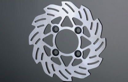 Metallic brake disc on a gray background