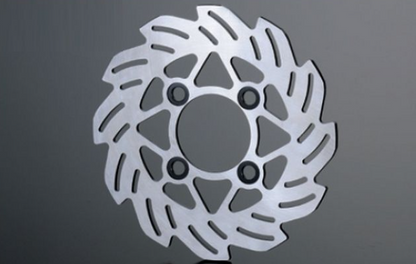 Metallic brake disc on a gray background