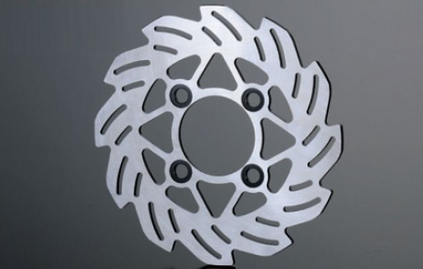 Metallic brake disc on a gray background